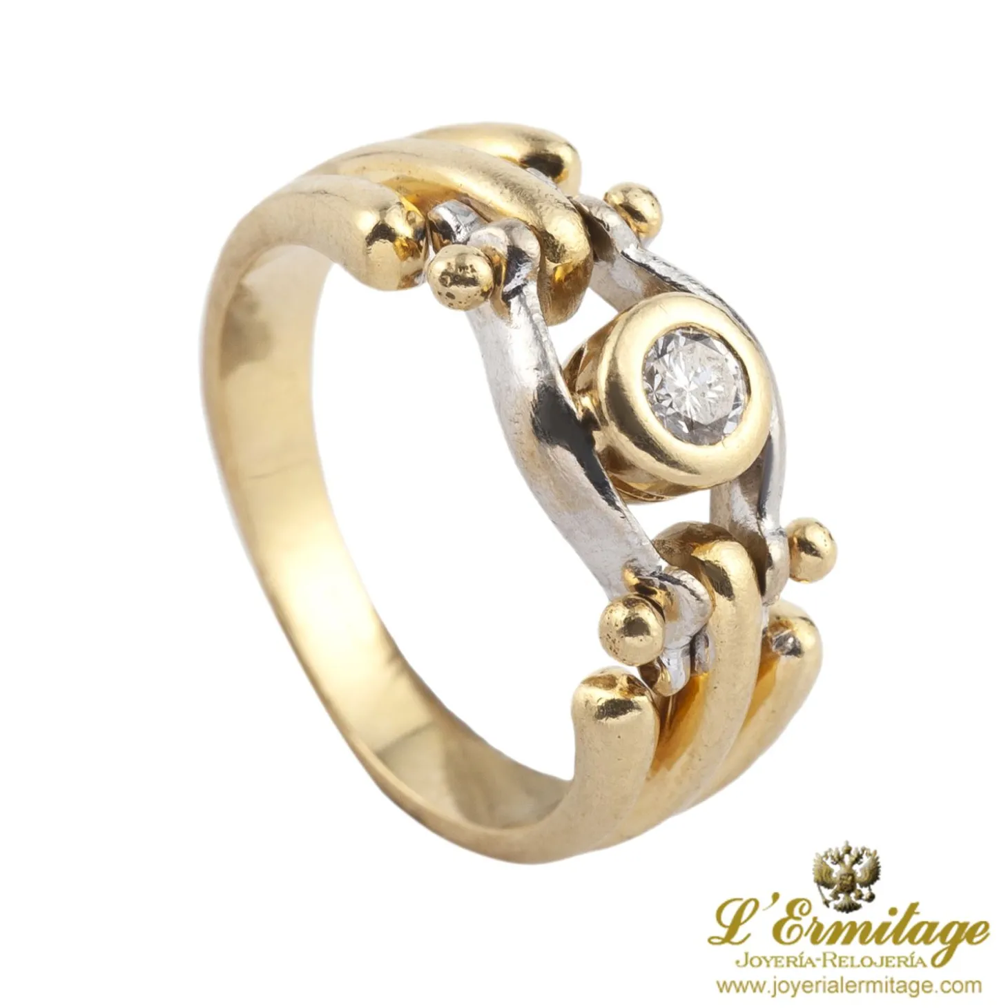 ANILLOS / SORTIJAS Solitario en oro amarillo y oro blanco con un brillante.