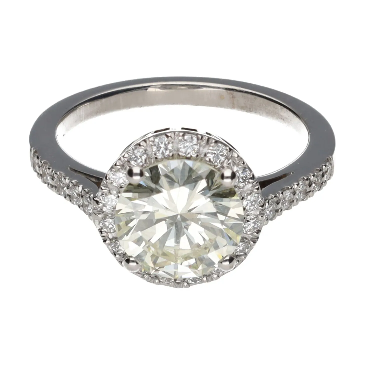 ANILLOS / SORTIJAS Solitario en oro blanco con brillante central y brillantes en orla y brazos. Talla 13.