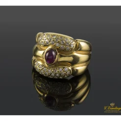 ANILLOS / SORTIJAS Sortija ancha oro amarillo rubí cabuchón y cuajado de diamantes