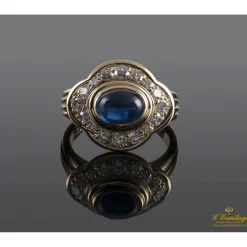 ANILLOS / SORTIJAS Sortija cartier antigua oro amarillo zafiro cabuchón y diamantes.