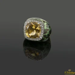 ANILLOS / SORTIJAS Sortija firmada por casato oro amarillo esmalte, un citrino y diamantes.