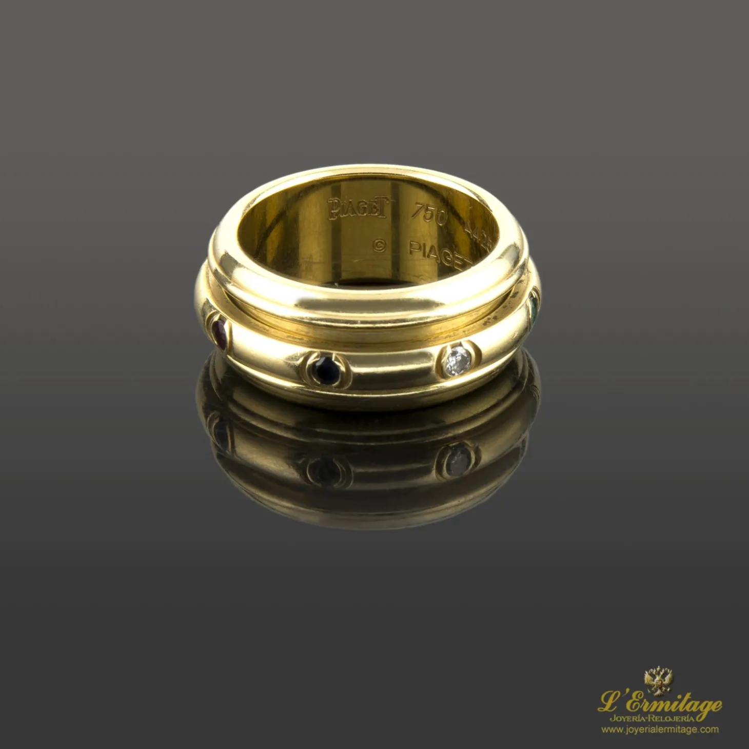 ANILLOS / SORTIJAS Sortija possession de piaget en oro amarillo, rubís, esmeraldas, zafiros y diamantes. Tallam nº 16.