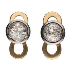 BOTONADURAS Botonadura en oro blanco y oro amarillo con diamantes.