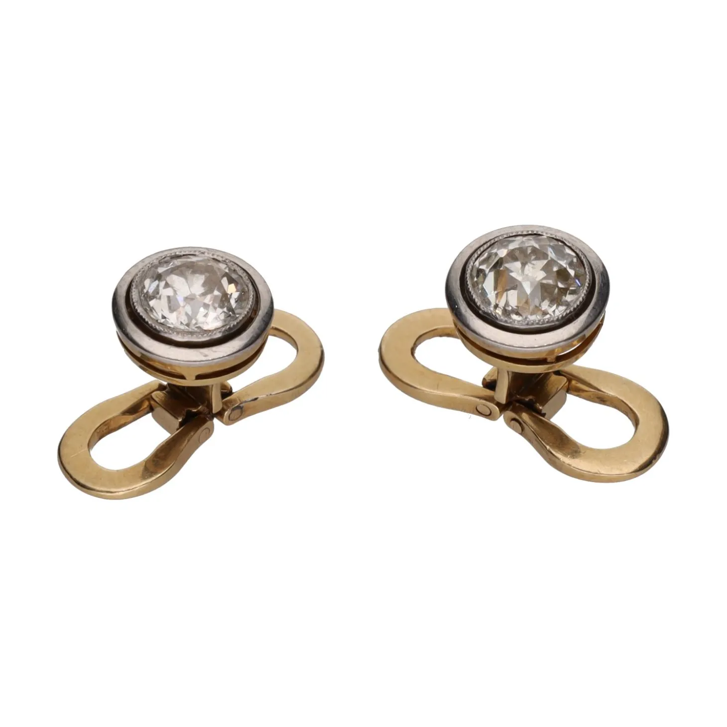 BOTONADURAS Botonadura en oro blanco y oro amarillo con diamantes.