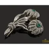 BROCHES / ALFILERES Broche en forma de palmeras realizado en oro blanco con esmeraldas y diamantes.