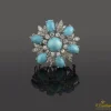 BROCHES / ALFILERES Broche en forma de flor oro blanco turquesas y diamantes.