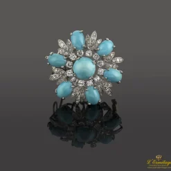 BROCHES / ALFILERES Broche en forma de flor oro blanco turquesas y diamantes.