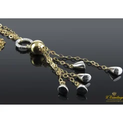 COLLARES Cadena doble de anillas realizada en oro blanco y oro amarillo.