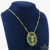 COLLARES Collar cristo dalí oro amarillo y malaquita. Presenta certificado a-9/10.
