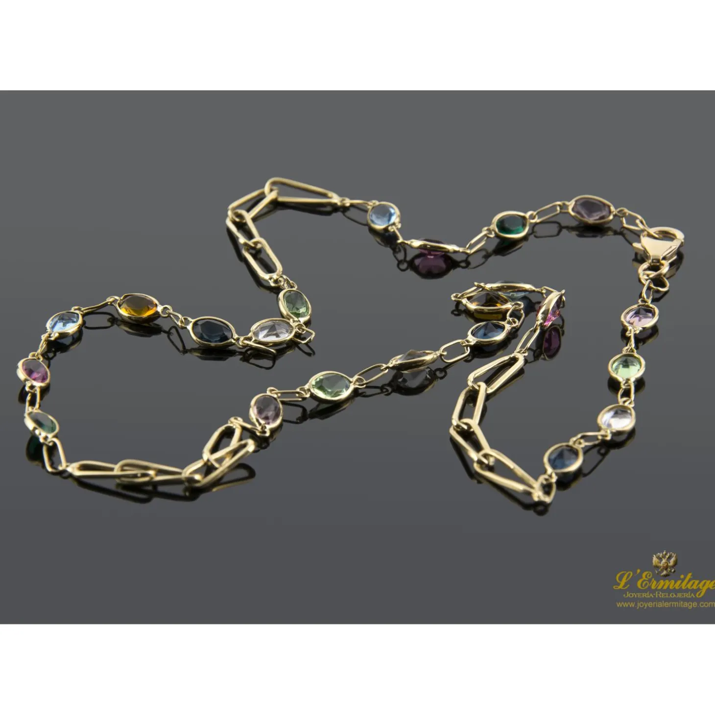 COLLARES Collar oro amarillo con piedras de color.