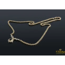 COLLARES Collar realizado en oro amarillo con un zafiro y brillantes .