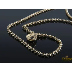 COLLARES Collar realizado en oro amarillo con un zafiro y brillantes .