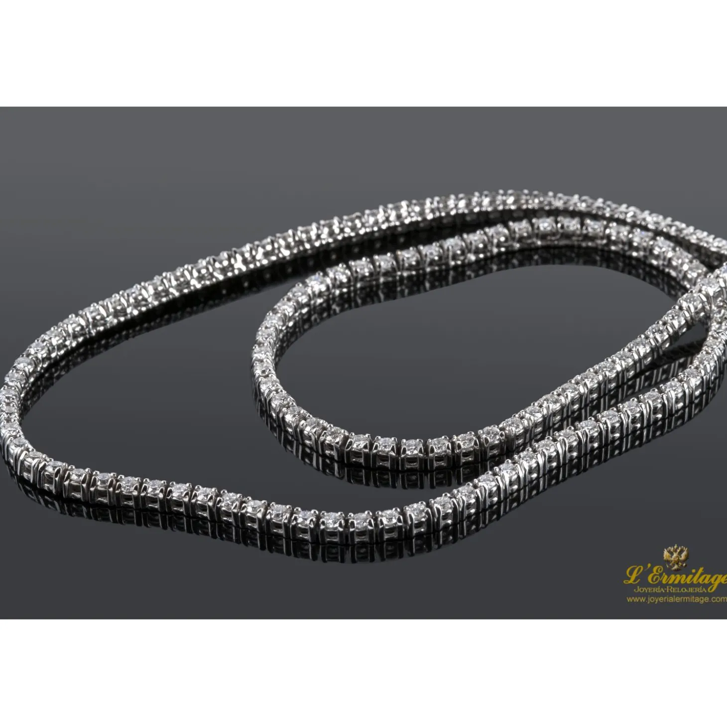 COLLARES Gargantilla riviere oro blanco y diamantes. 40 Cm largo.
