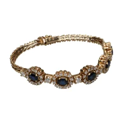 GEMELOS Pulsera en oro amarillo de 14k con zafiros y brillantes.