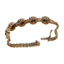 GEMELOS Pulsera en oro amarillo de 14k con zafiros y brillantes.