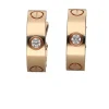 PENDIENTES Pendientes love de cartier en oro rosa con brillantes.