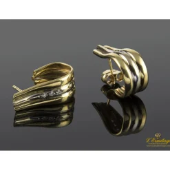 PENDIENTES Pendientes realizados en oro amarillo y oro blanco con fila de zirconitas.
