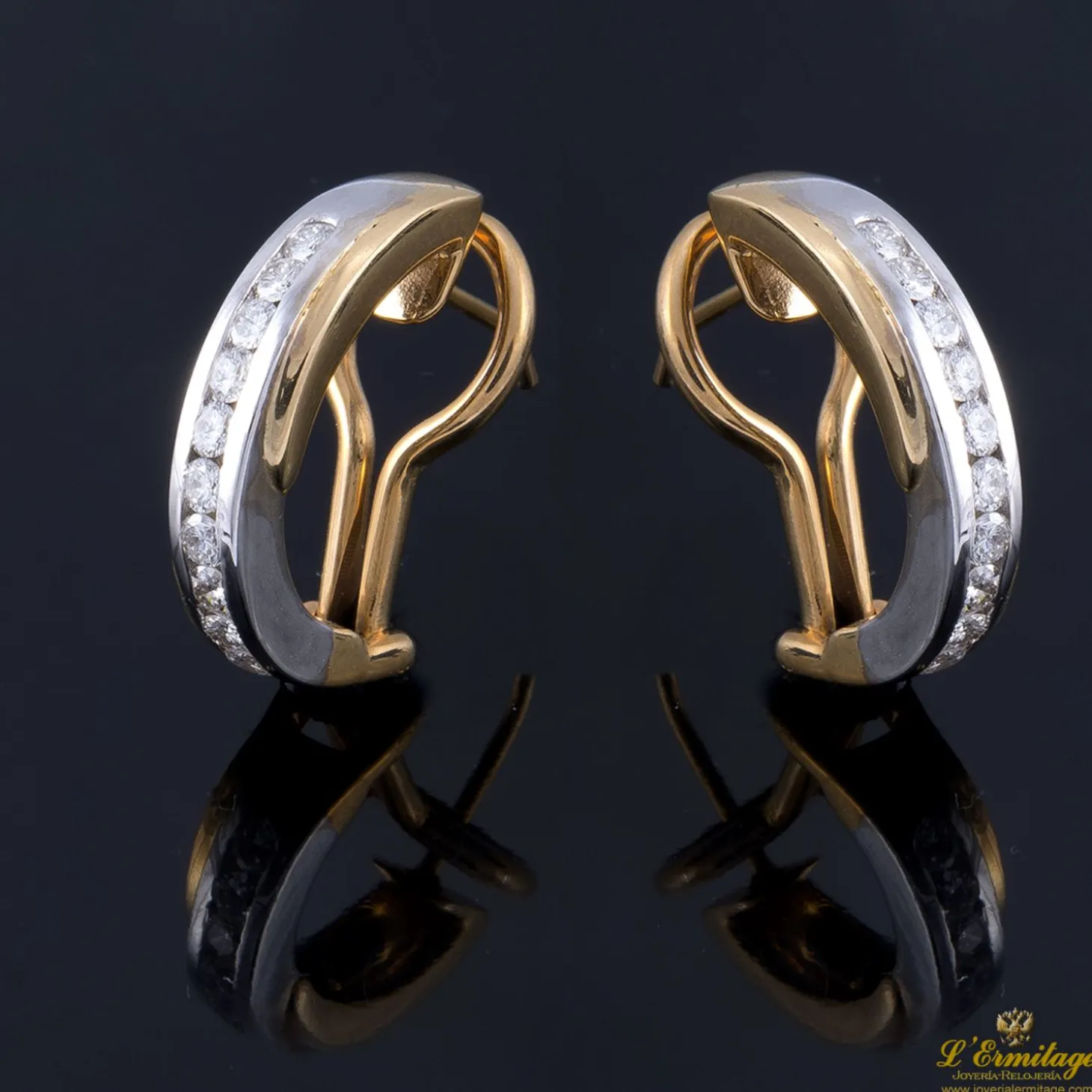 PENDIENTES Pendientes realizados en oro blanco y oro amarillo con brillantes.