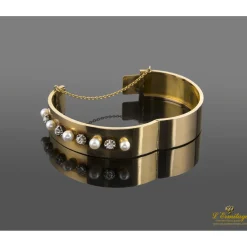 PULSERAS Pulsera antigua rígida oro amarillo perlas y diamantes.