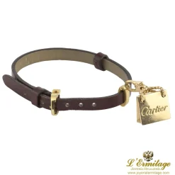 PULSERAS Pulsera cuero cartier con adorno de bolso en oro amarillo
