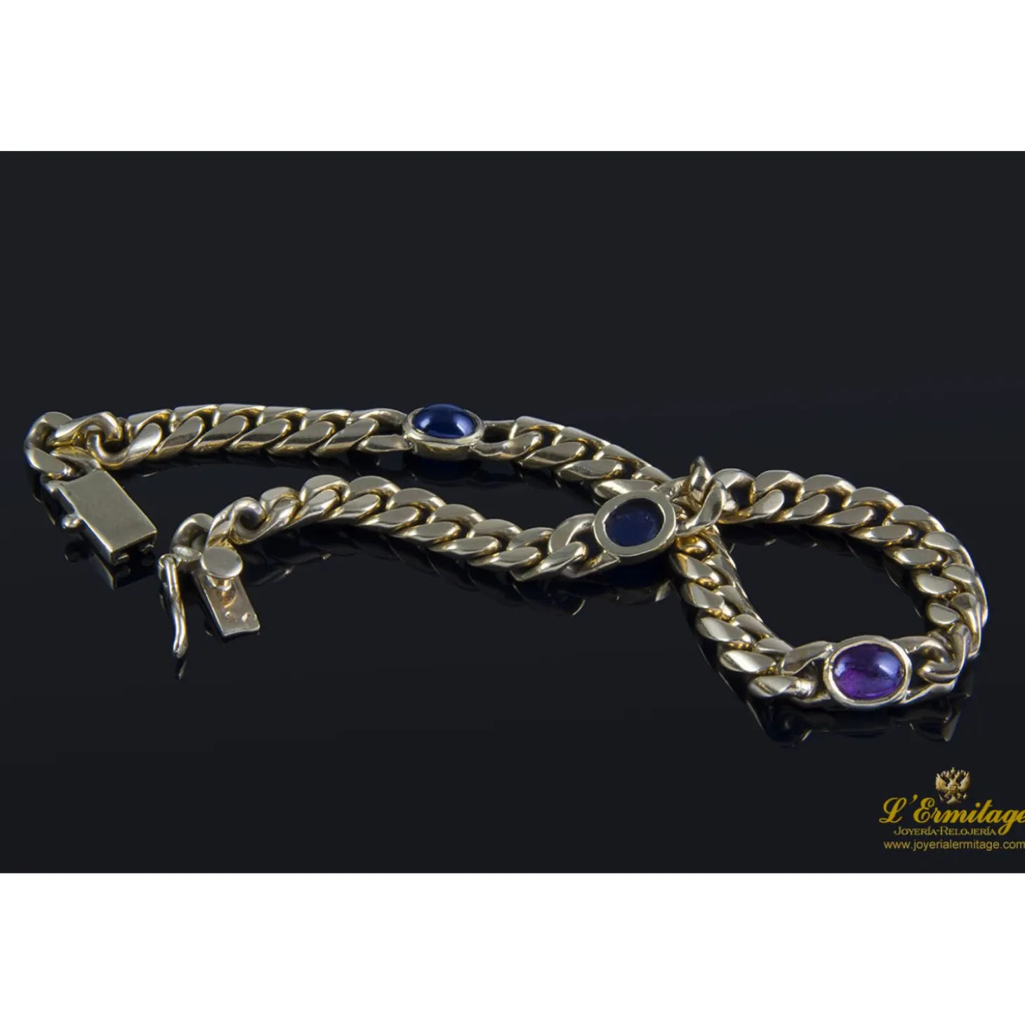 PULSERAS Pulsera en oro amarillo con rubí y zafiros