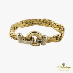 PULSERAS Pulsera en oro amarillo y un zafiro.