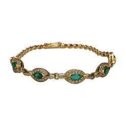 PULSERAS Pulsera en oro amarillo con esmeraldas y brillantes.