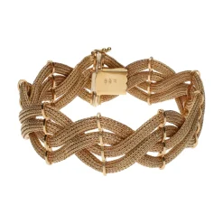PULSERAS Pulsera en oro amarillo en forma de trenza de mallas.