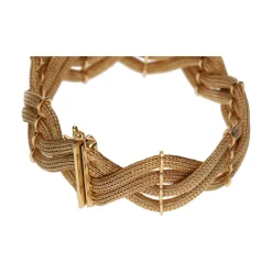 PULSERAS Pulsera en oro amarillo en forma de trenza de mallas.