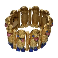 PULSERAS Pulsera en oro amarillo con detalles en formas de loro.