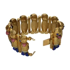 PULSERAS Pulsera en oro amarillo con detalles en formas de loro.