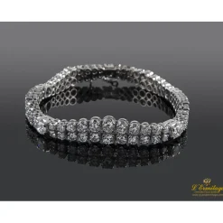 PULSERAS Pulsera en oro blanco con doble fila de brillantes.