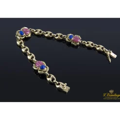 PULSERAS Pulsera realizada en oro amarillo con escarabajos en lapislázuli y rodocrosita.