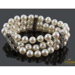 PULSERAS Pulsera realizada en tiras con perlas y uniones en oro blanco con brillantes