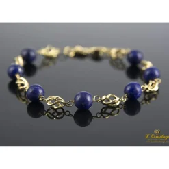 PULSERAS Pulsera realizada en oro amarillo con bolas de lapislázulis.