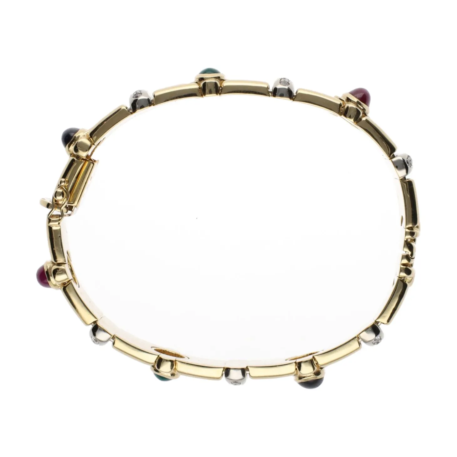 PULSERAS Pulsera rígida en oro amarillo con zafiros, rubíes, esmeraldas y brillantes.