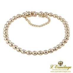 PULSERAS Pulsera riviere en oro amarillo y brillantes.