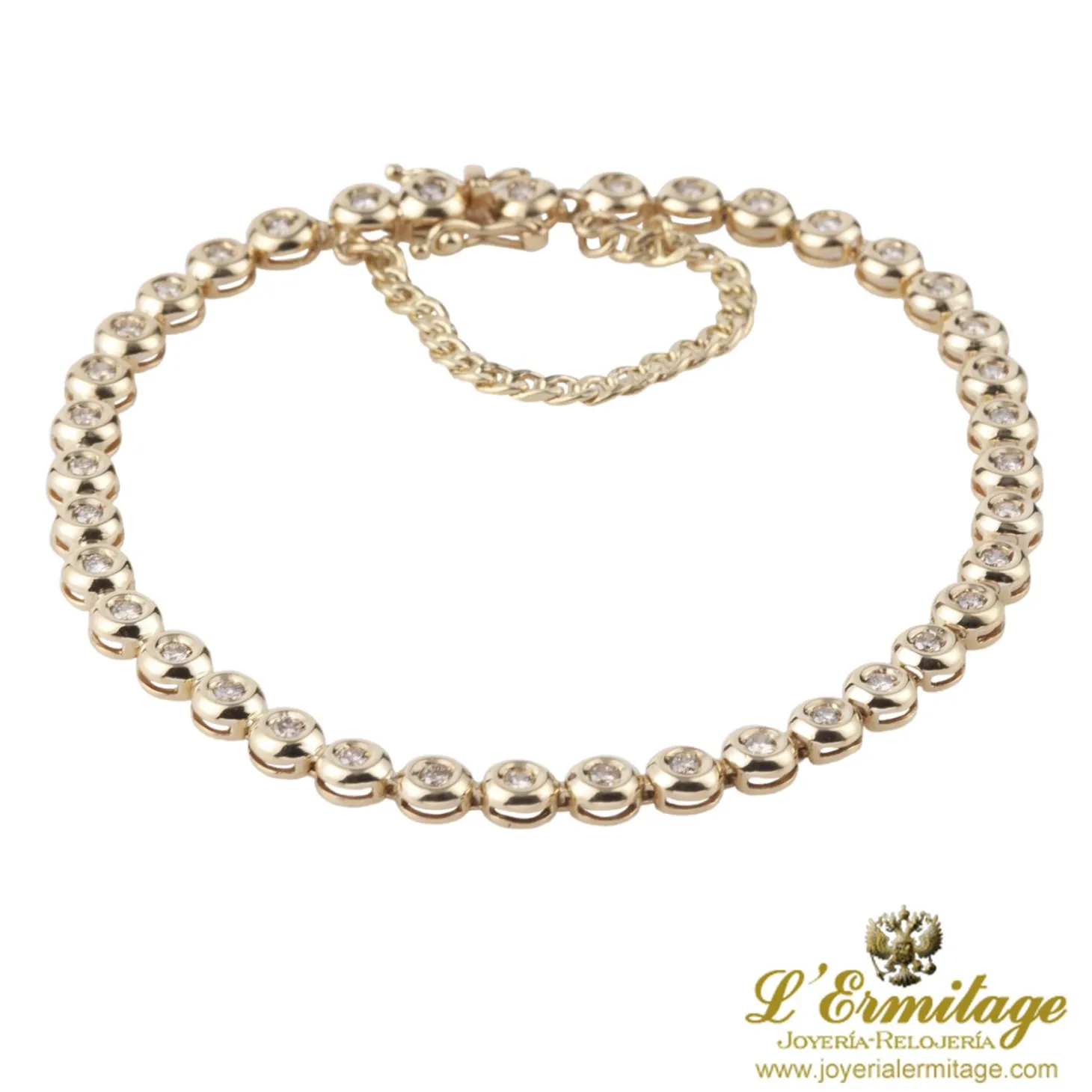 PULSERAS Pulsera riviere en oro amarillo y brillantes.