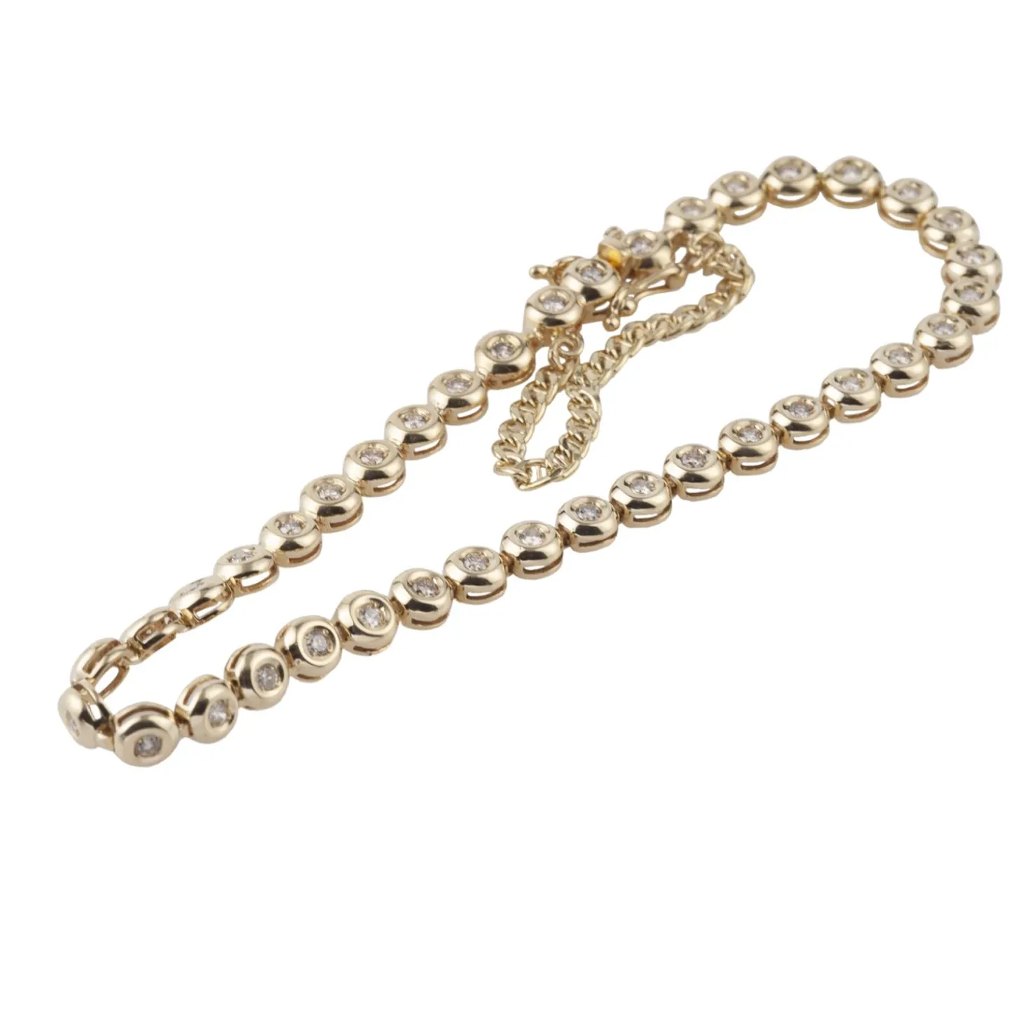 PULSERAS Pulsera riviere en oro amarillo y brillantes.