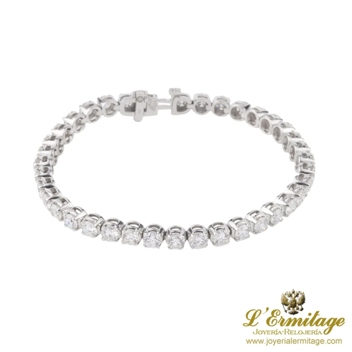 PULSERAS Pulsera riviere en oro blanco con brillantes.